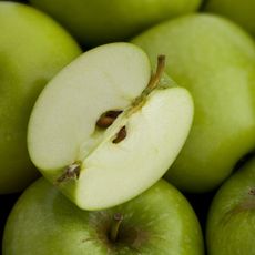 apple fruit sliced showing seeds and core